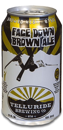 Face down brown ale can